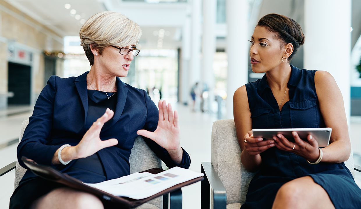 two businesswomen talking together